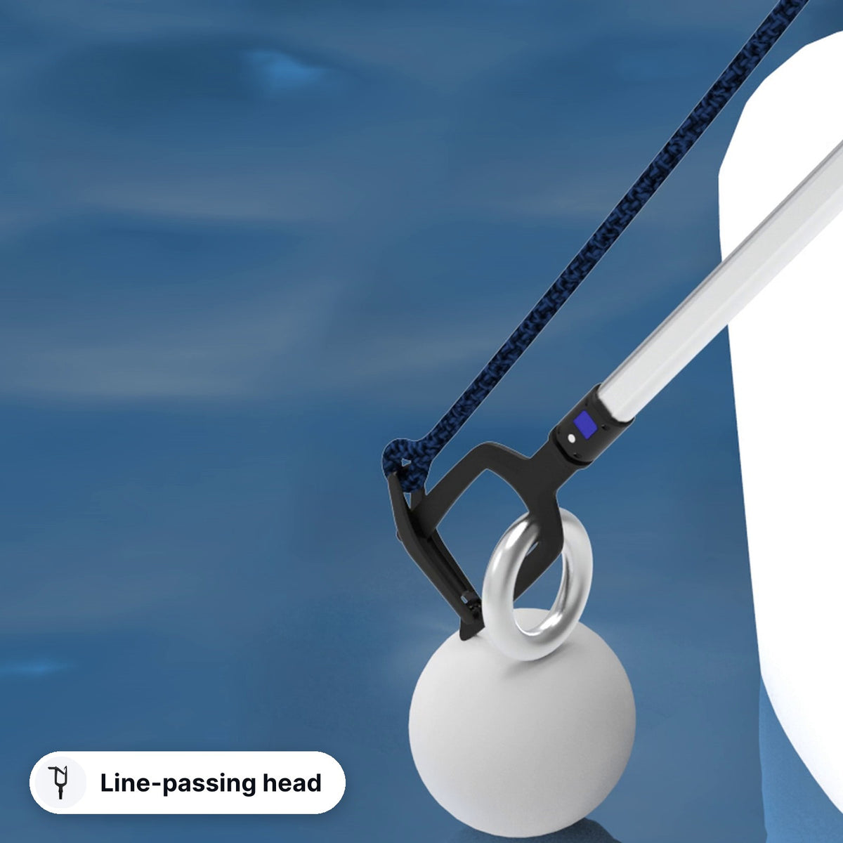 Jake line-passing head passing a line through a mooring buoy ring